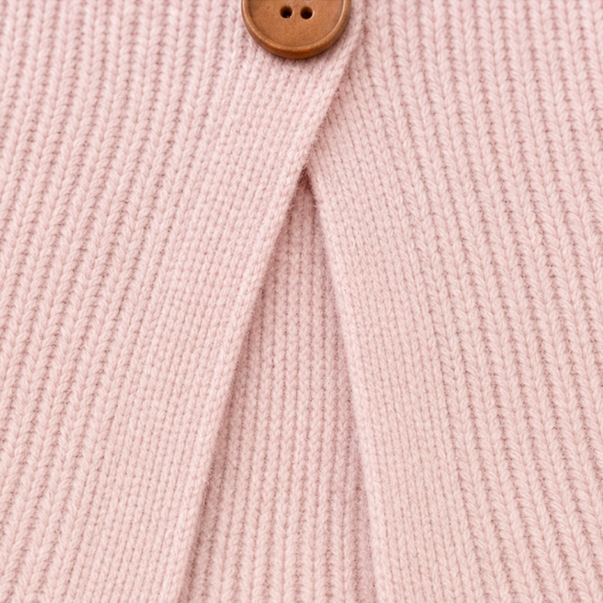 Pink v-neck knit sweater button placket opening with wood-look button