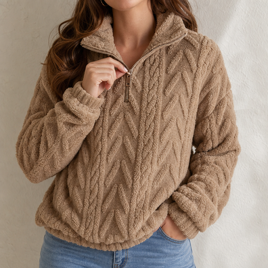 Tan cable-knit quarter-zip pullover sweater with textured high collar and zipper placket