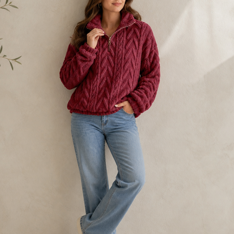 Burgundy cable-knit quarter-zip pullover with raised zigzag cable pattern and zip neck