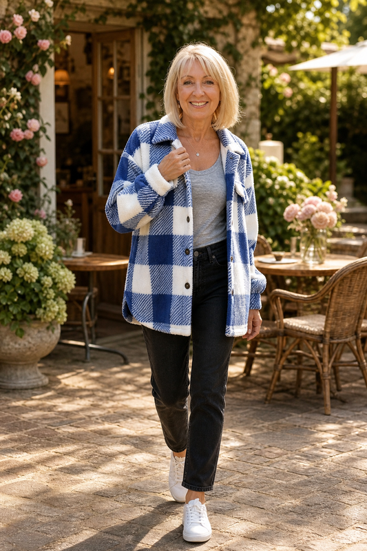 Blue and white plaid button-front overshirt jacket worn over dark jeans, long sleeves