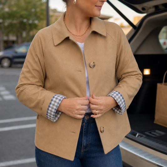 Beige raglan casual coat with notch collar, button front, and plaid-lined cuffs