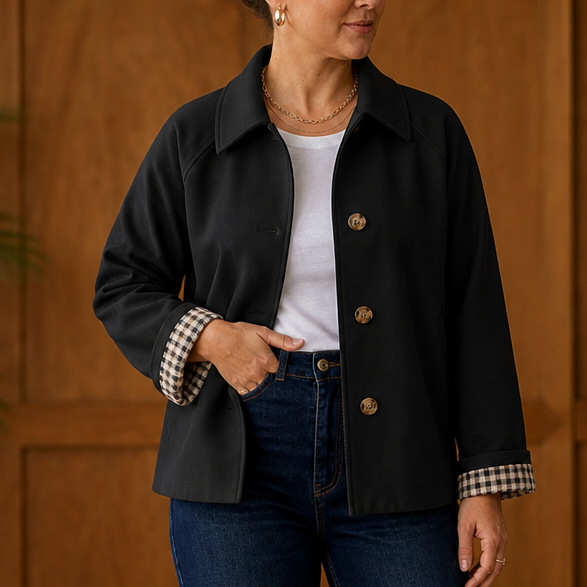Black raglan casual coat with button front and plaid-lined sleeve cuffs