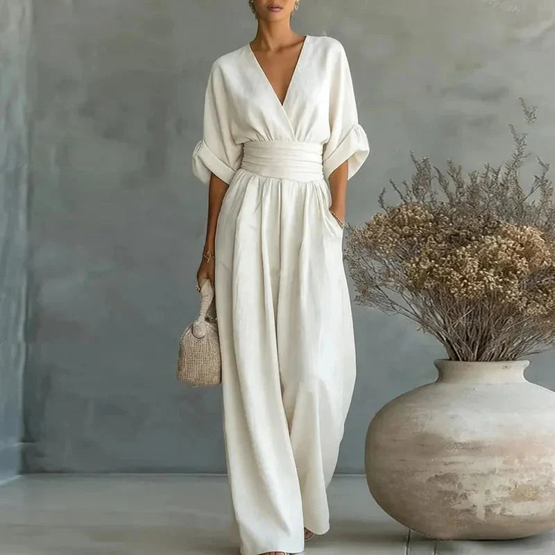 White chiffon wide-leg jumpsuit with V-neck, short sleeves and elastic waist