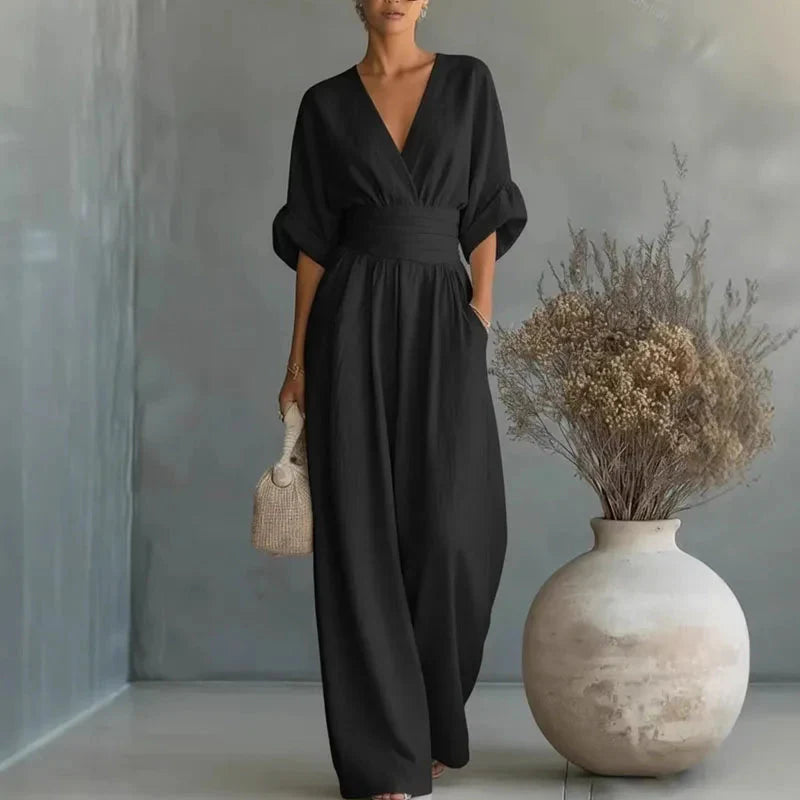 Black chiffon wide-leg jumpsuit with V-neck, short sleeves and elastic waist
