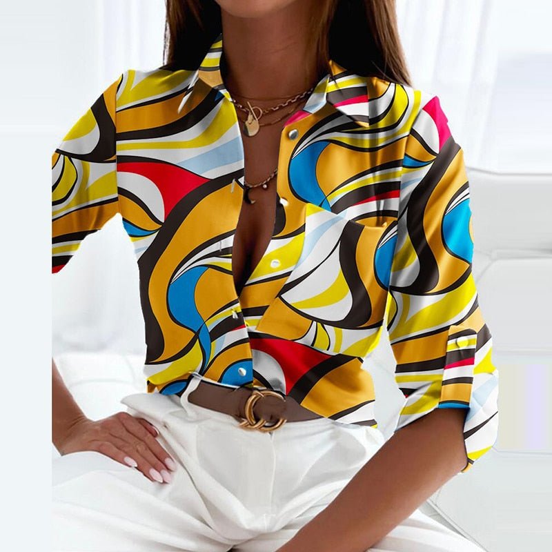 Collared button-up blouse in white with colorful abstract swirl print, short sleeves