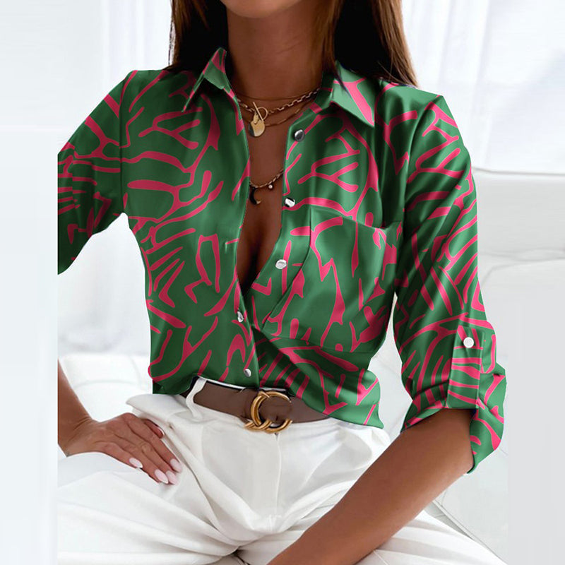 Collared button-up blouse in green with pink abstract line pattern, button front