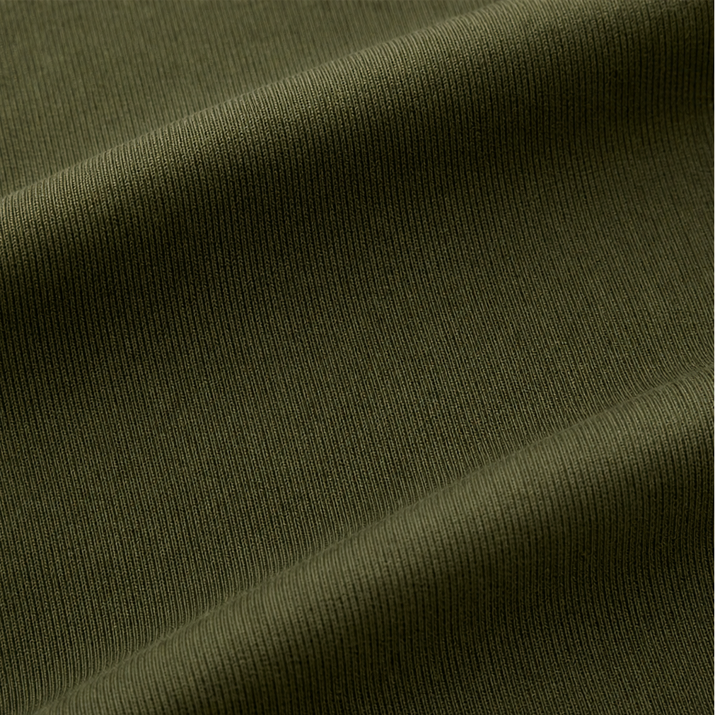 Olive green ribbed knit fabric close-up