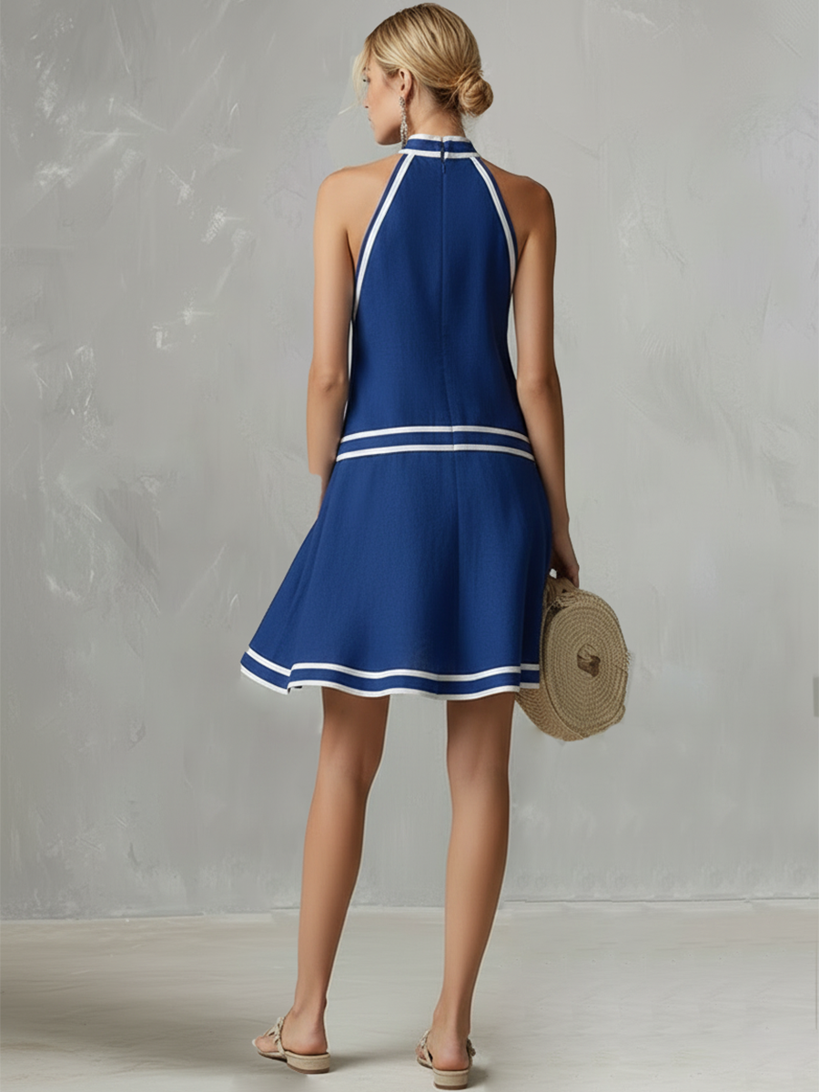 Cotton-linen halter mini dress in blue with white contrast piping; back halter straps.