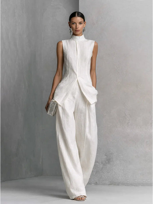 White cotton-linen wide-leg pants set with high-neck sleeveless top and shell buttons
