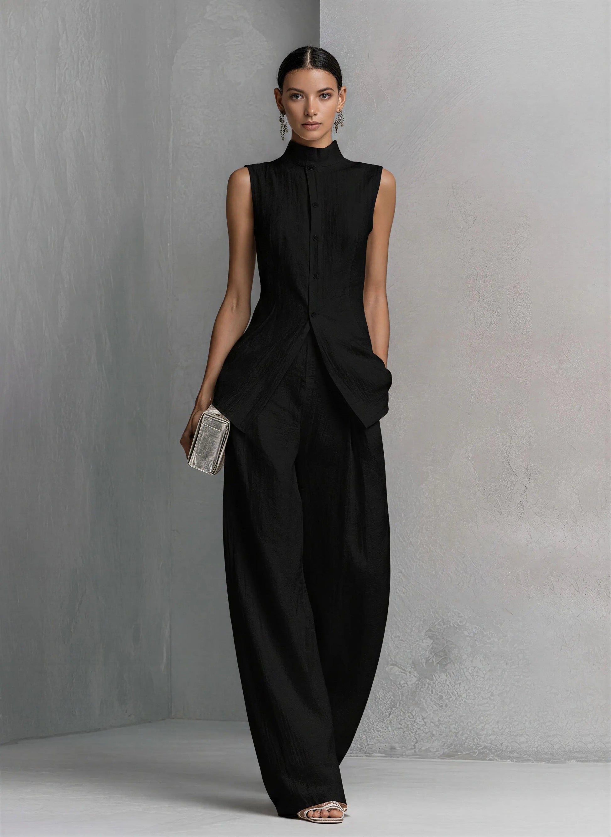 Black cotton-linen wide-leg pants set with sleeveless high-neck top and shell buttons