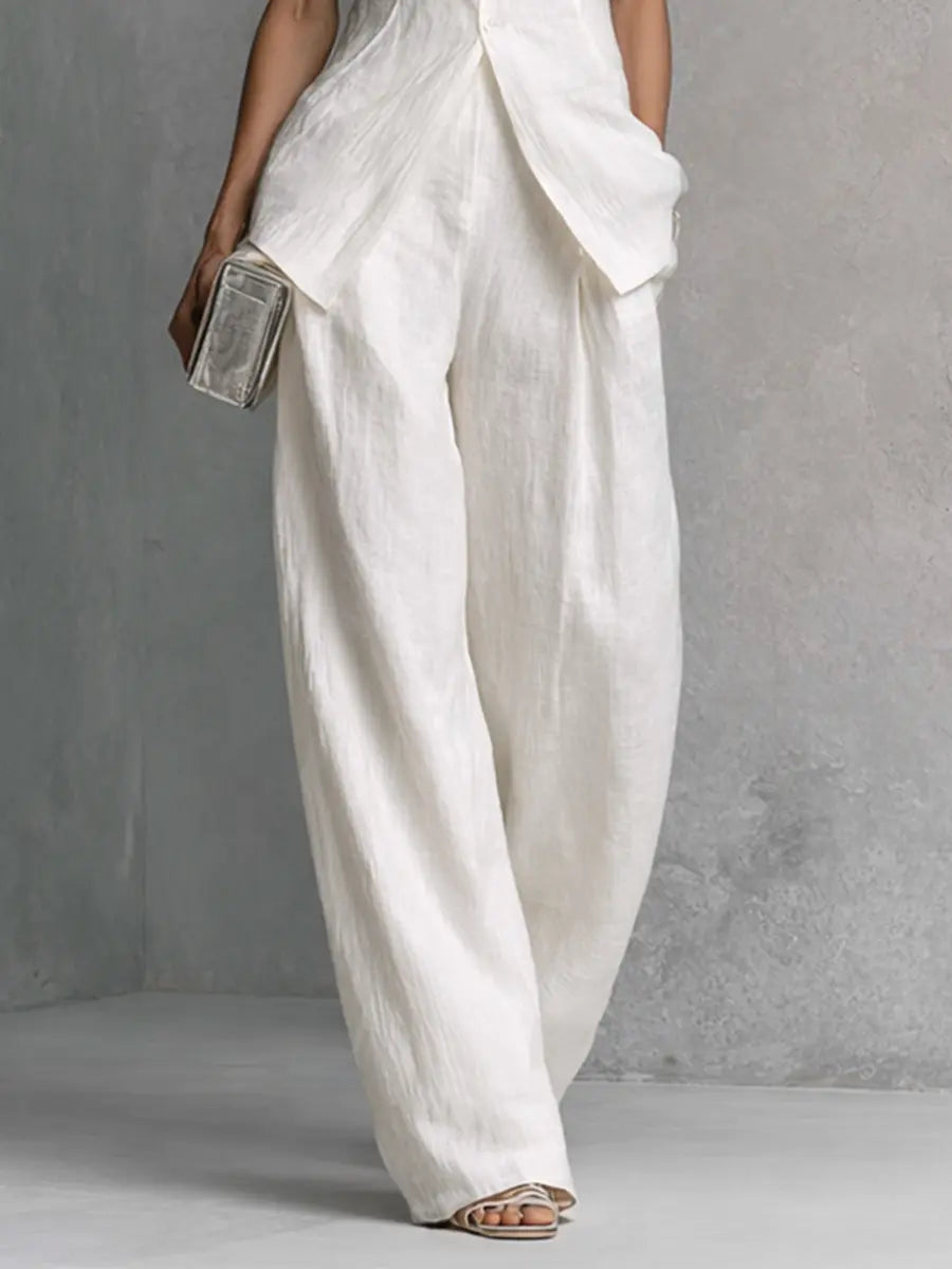 White cotton-linen wide-leg pants set with sleeveless top and shell buttons