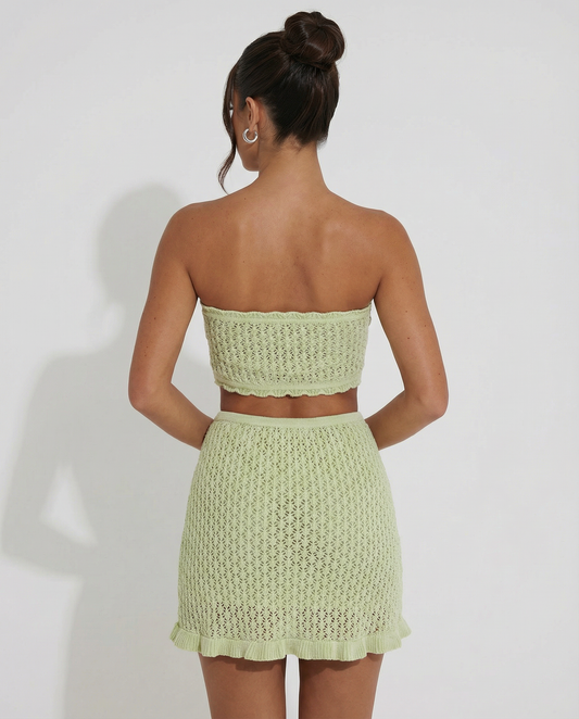 Mint green crochet strapless bandeau and matching ruffled mini skirt set, back view