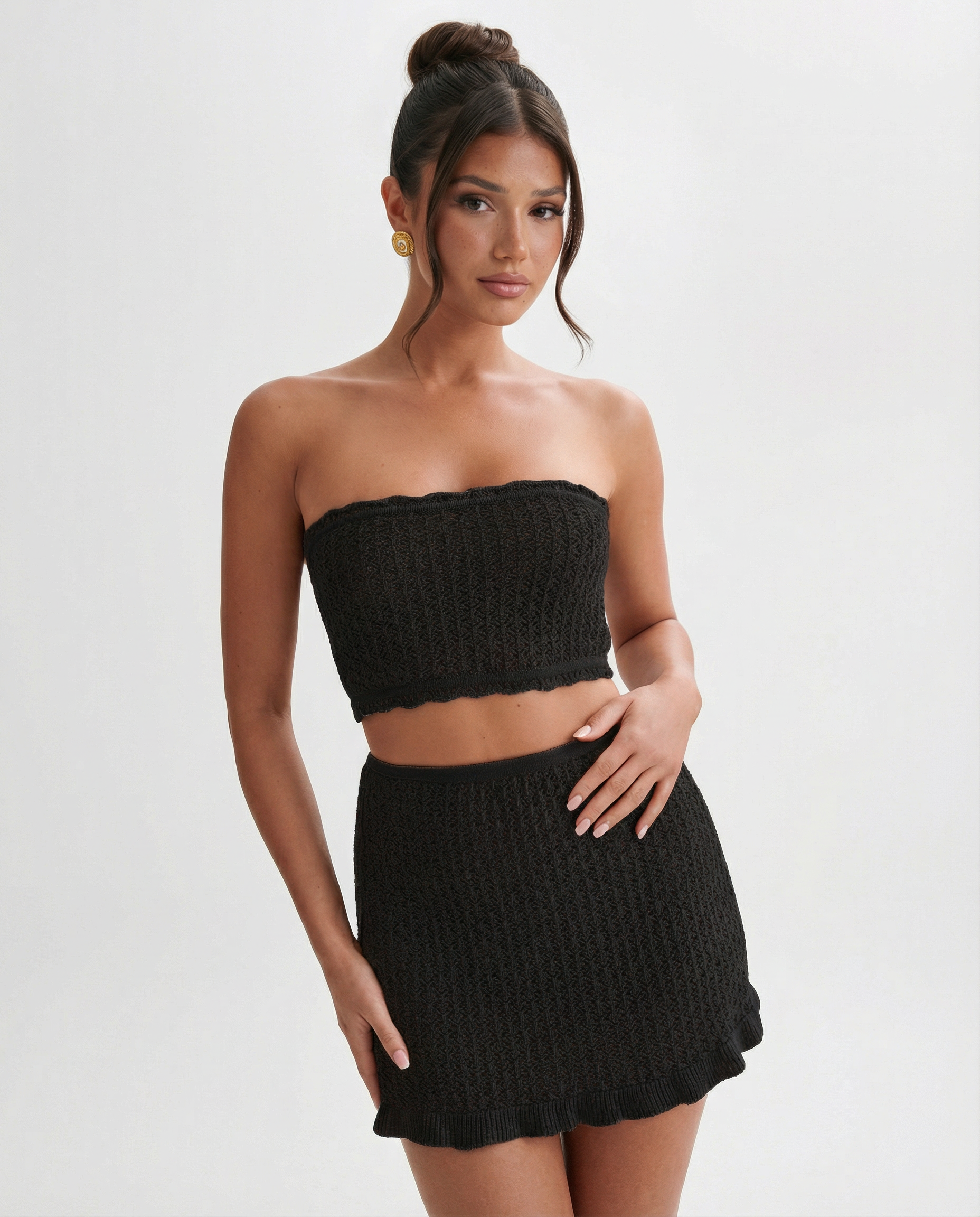 Black crochet strapless bandeau top and matching ruffled mini skirt set