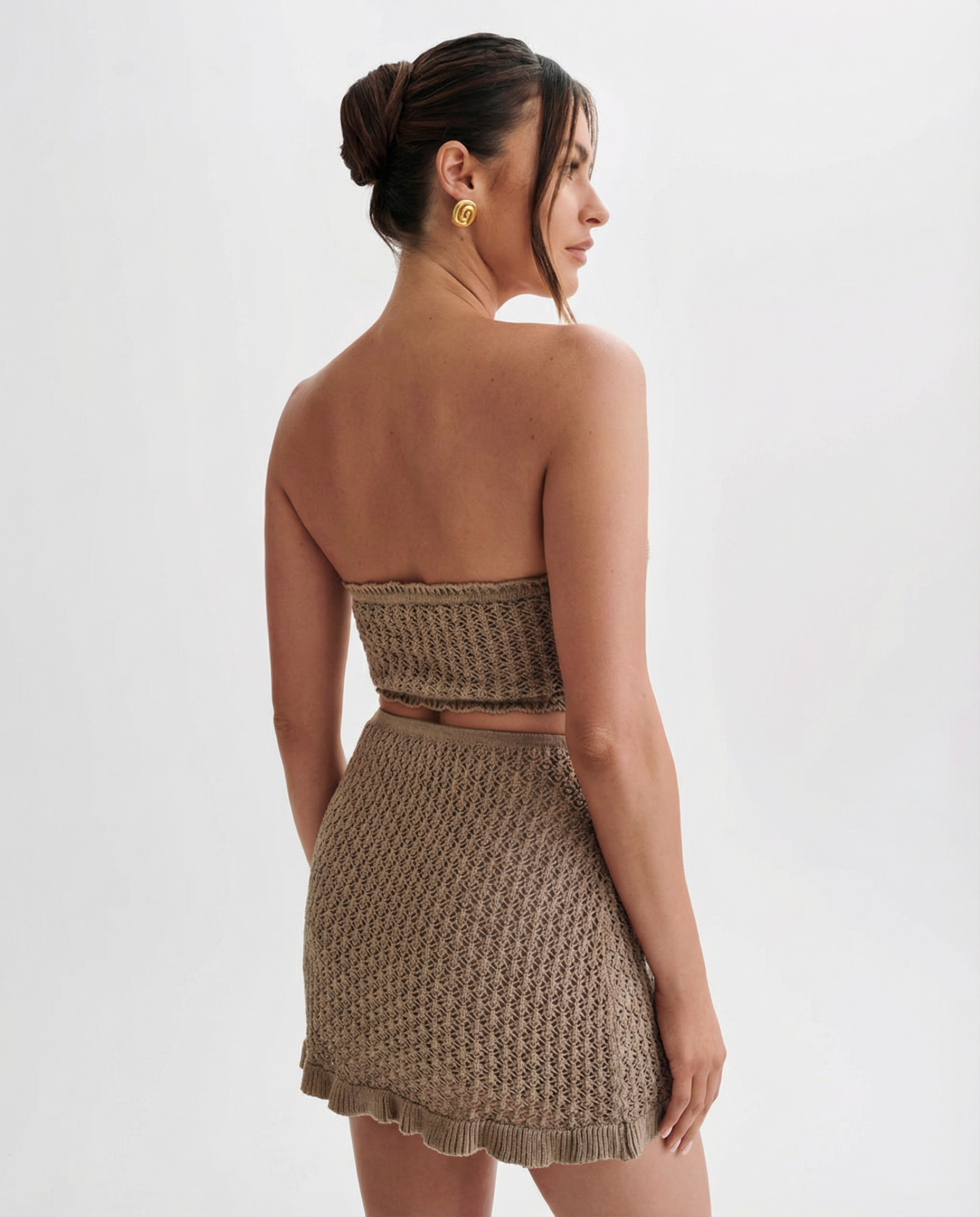 Khaki crochet strapless bandeau top and matching ruffled mini skirt set, back view