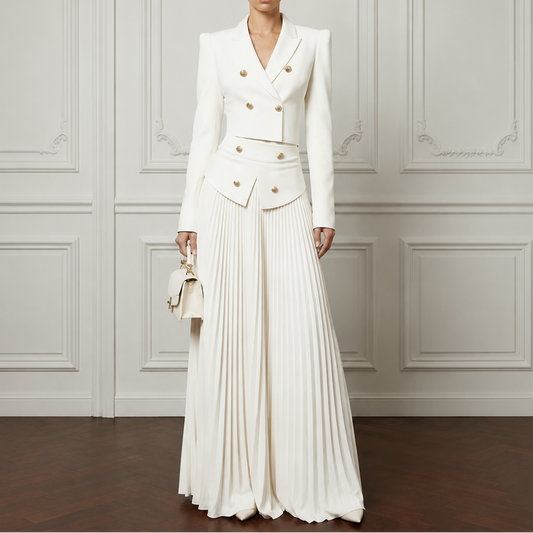 White cropped padded blazer and pleated midi skirt set with gold button details.