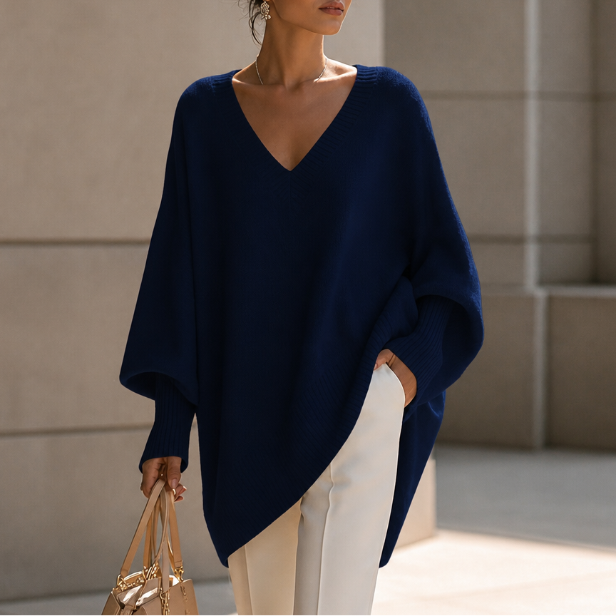 Dark navy draped V-neck stretch-knit sweater with loose batwing sleeves and ribbed cuffs