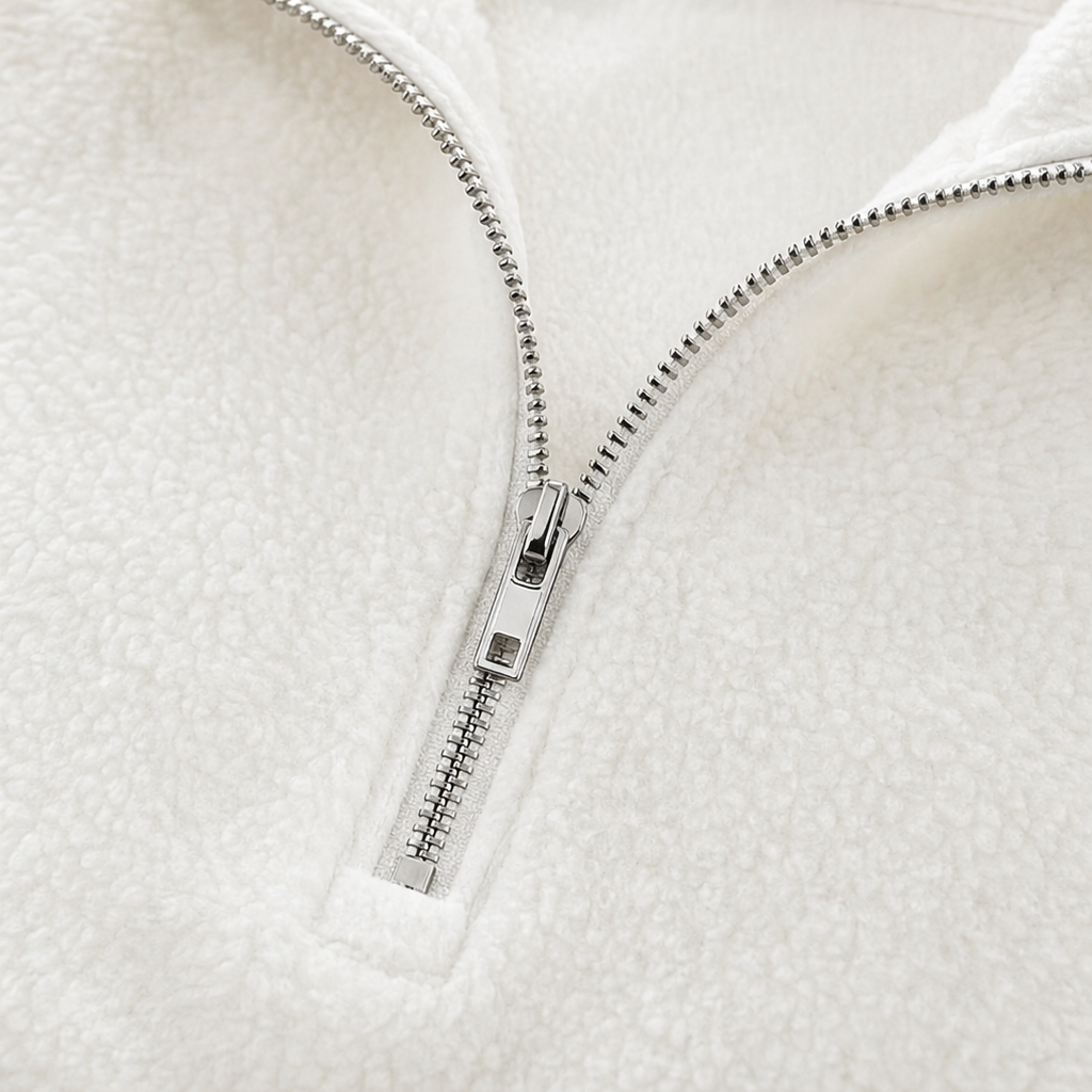 Cream white quarter-zip pullover zipper and placket close-up