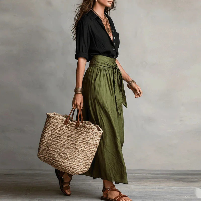 Tie-waist co-ord set with black button-front blouse and green drawstring midi skirt