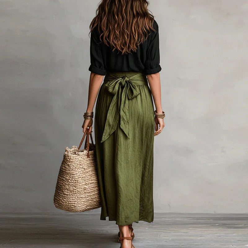 Tie-waist co-ord set with black blouse and olive drawstring midi skirt, back view