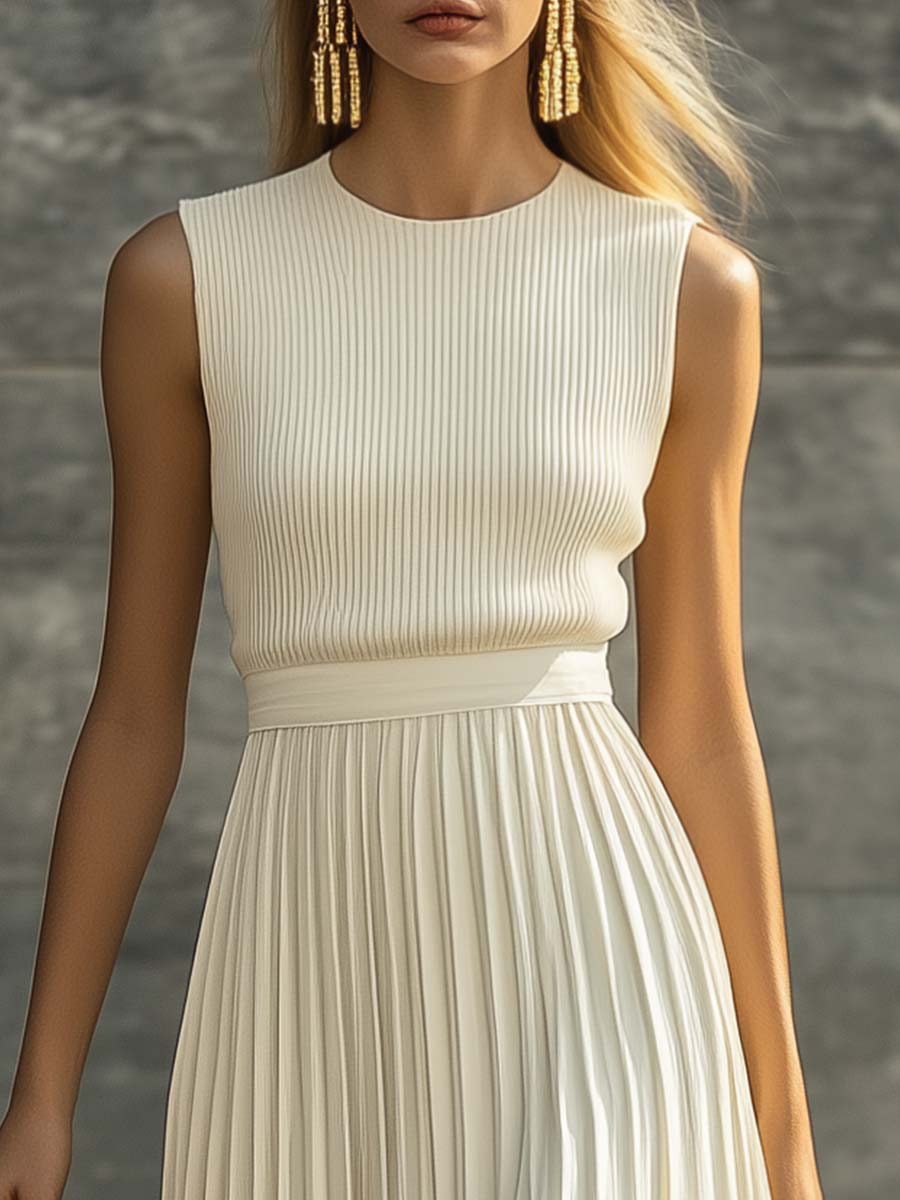 Cream chiffon maxi dress close-up: sleeveless ribbed bodice and waist gathers