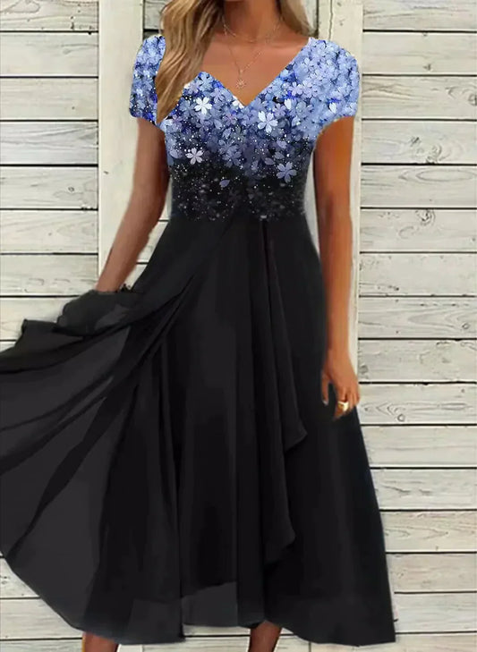 V-neck midi dress with blue floral bodice and black tiered skirt