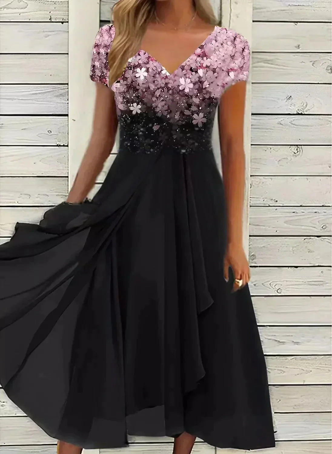 V-neck midi dress with pink floral bodice and black tiered skirt