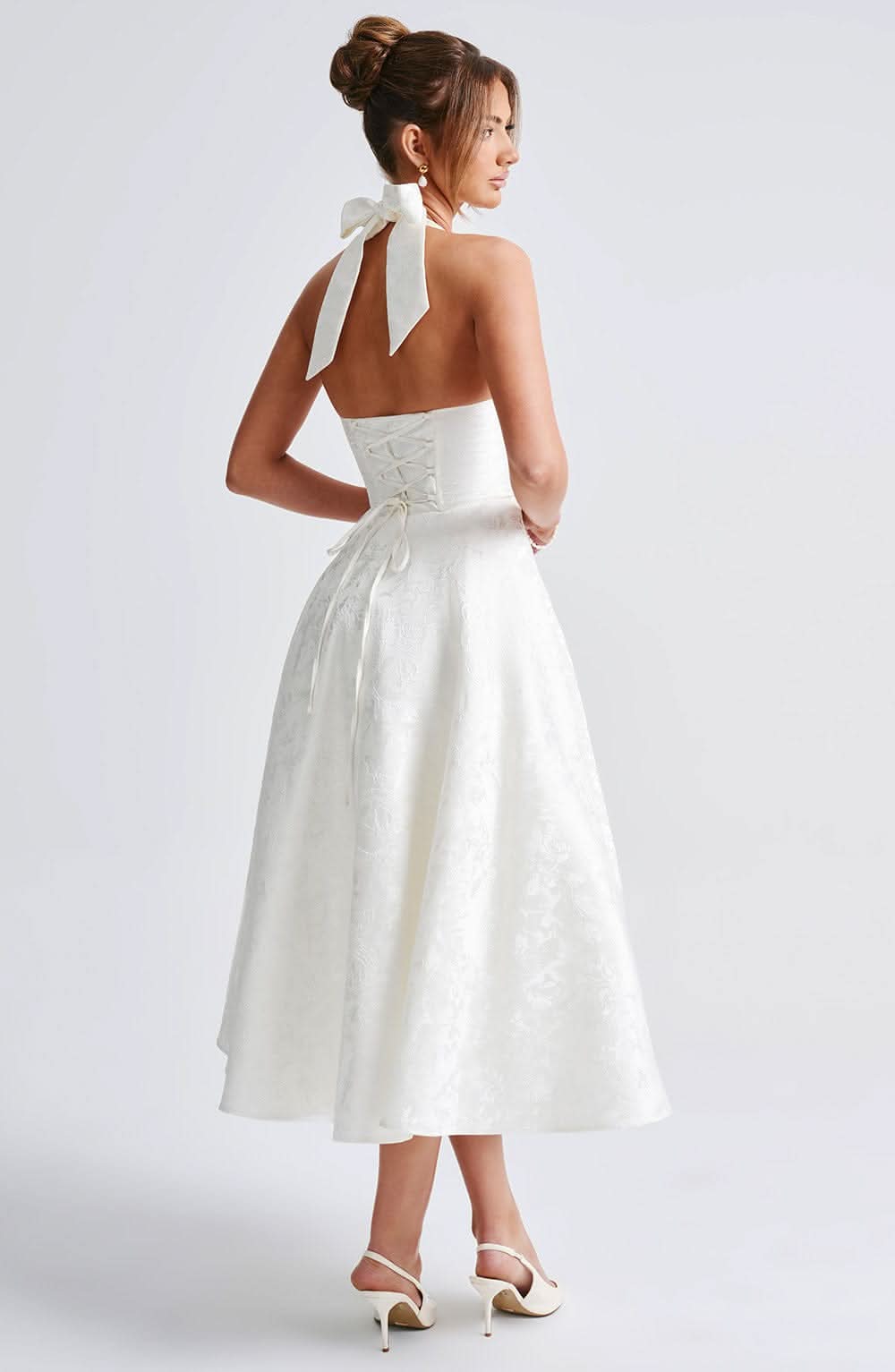 Ivory halter midi dress, open-back design with tied neck and full skirt