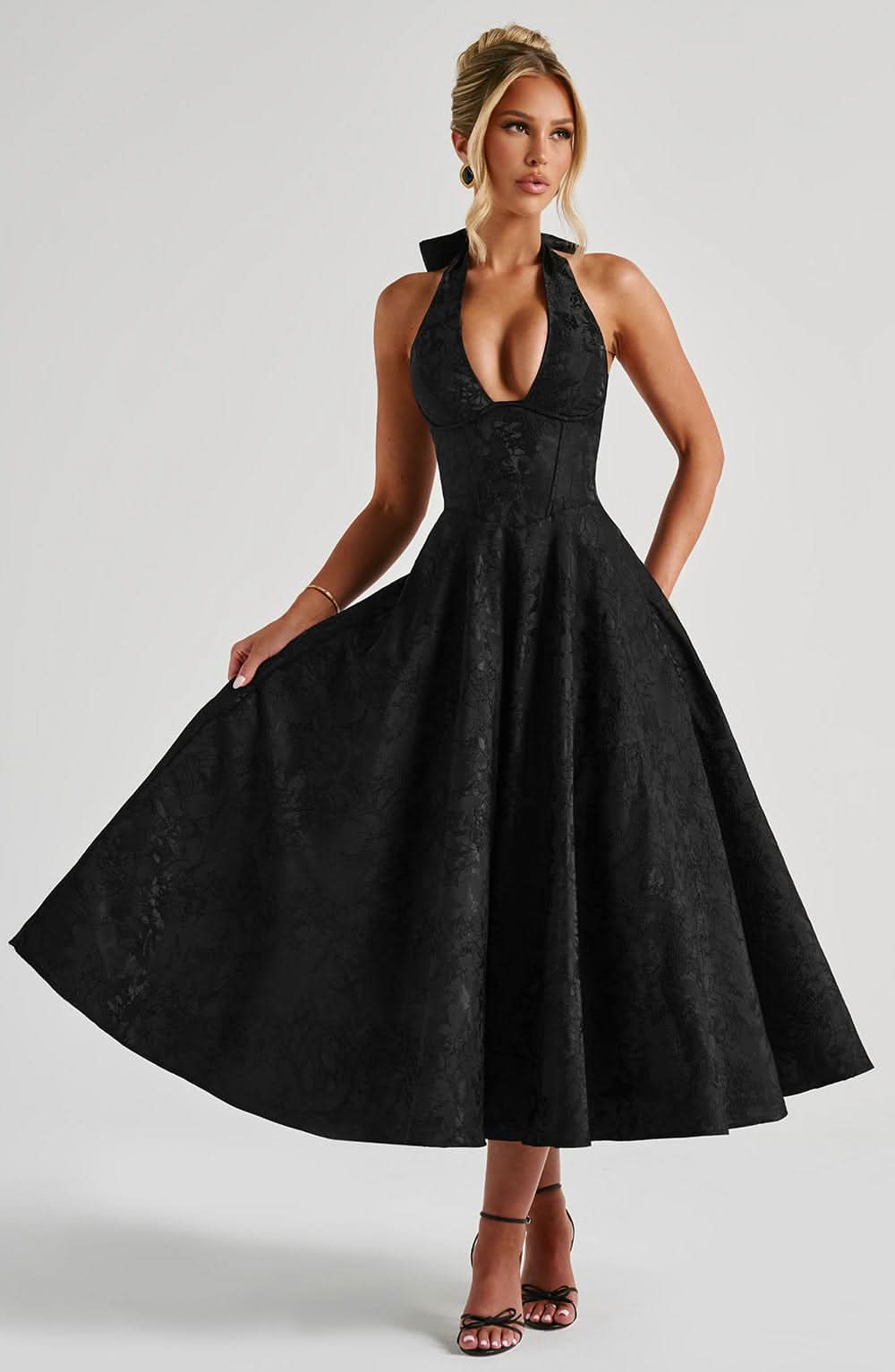 Black halter midi dress with floral jacquard, deep V halter neckline and full skirt
