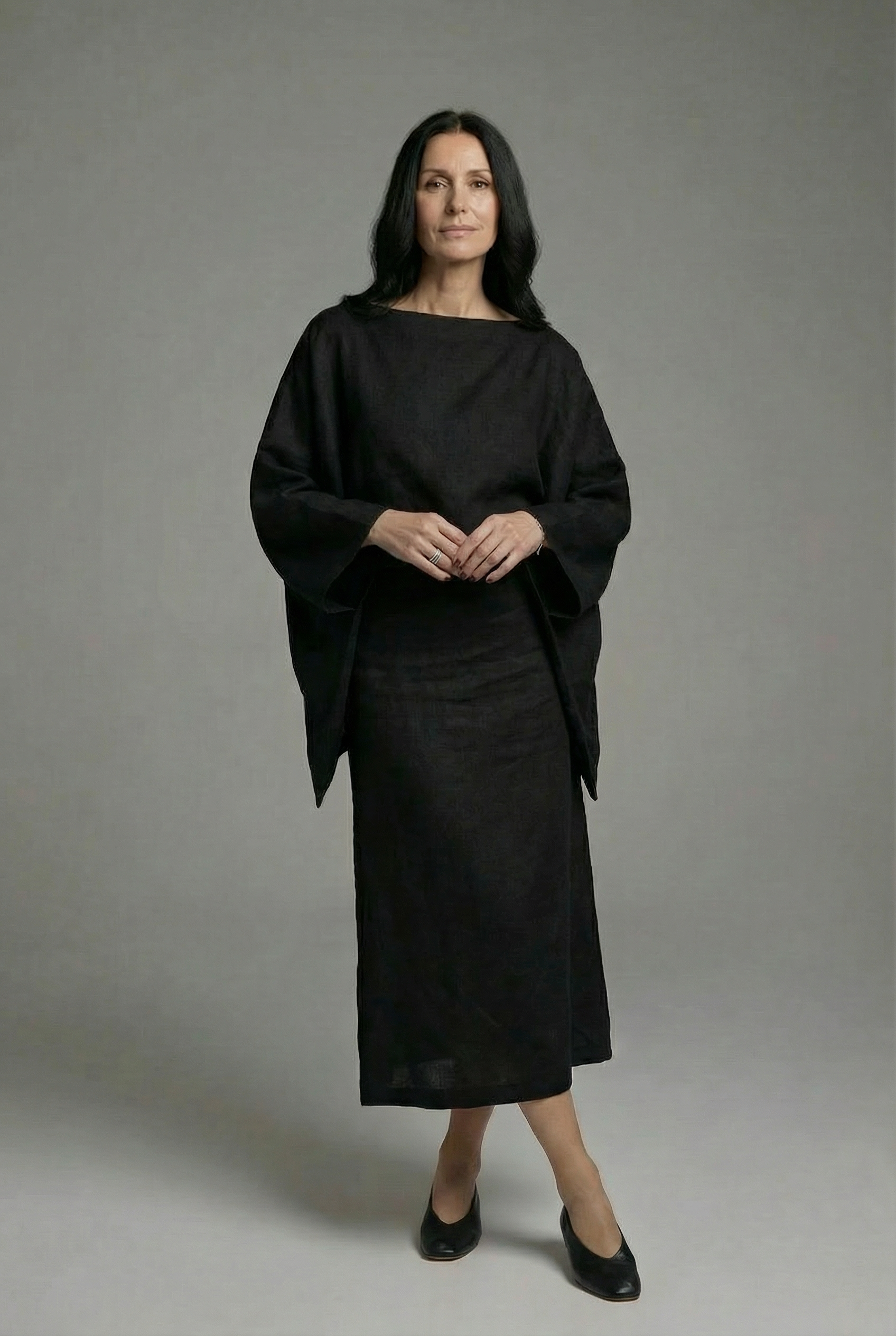 Black kimono midi dress with wide sleeves and tie waist, round neckline.