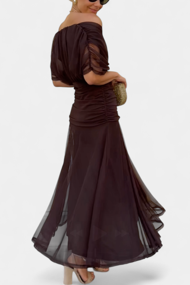 Brown off-shoulder ruched maxi dress, side view with flowing sheer skirt