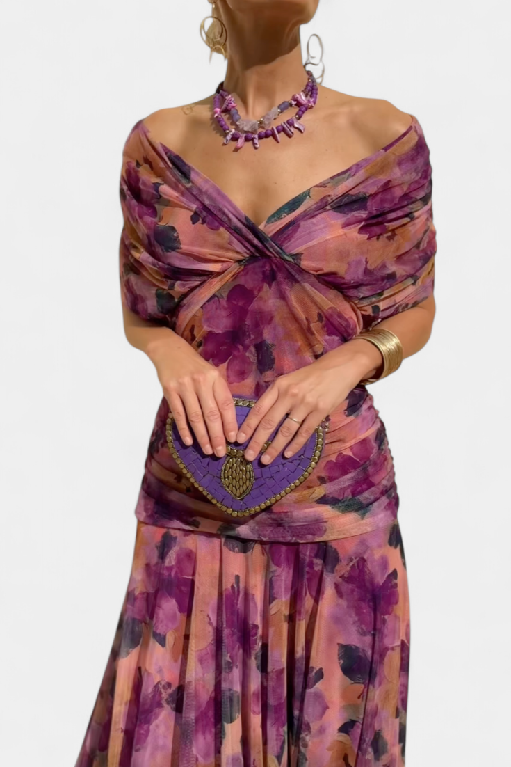 Ruched off-shoulder maxi dress in purple floral print with gathered bodice and flowing skirt