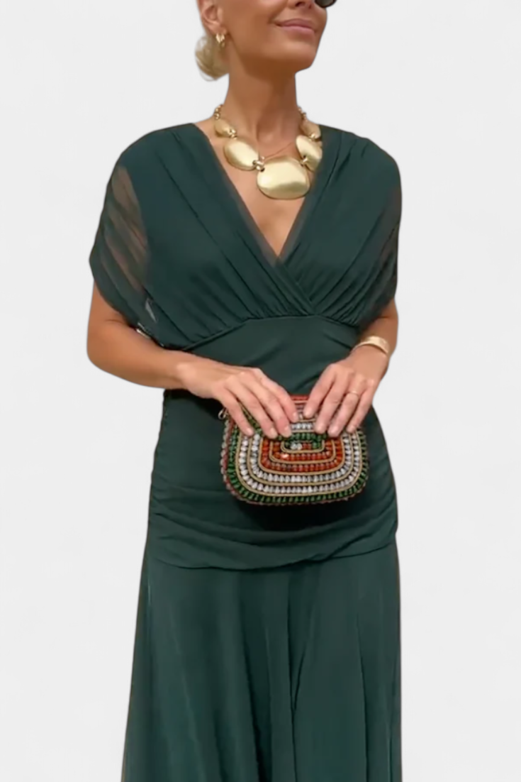 Deep green ruched off-shoulder maxi dress with draped V neckline and flowing skirt