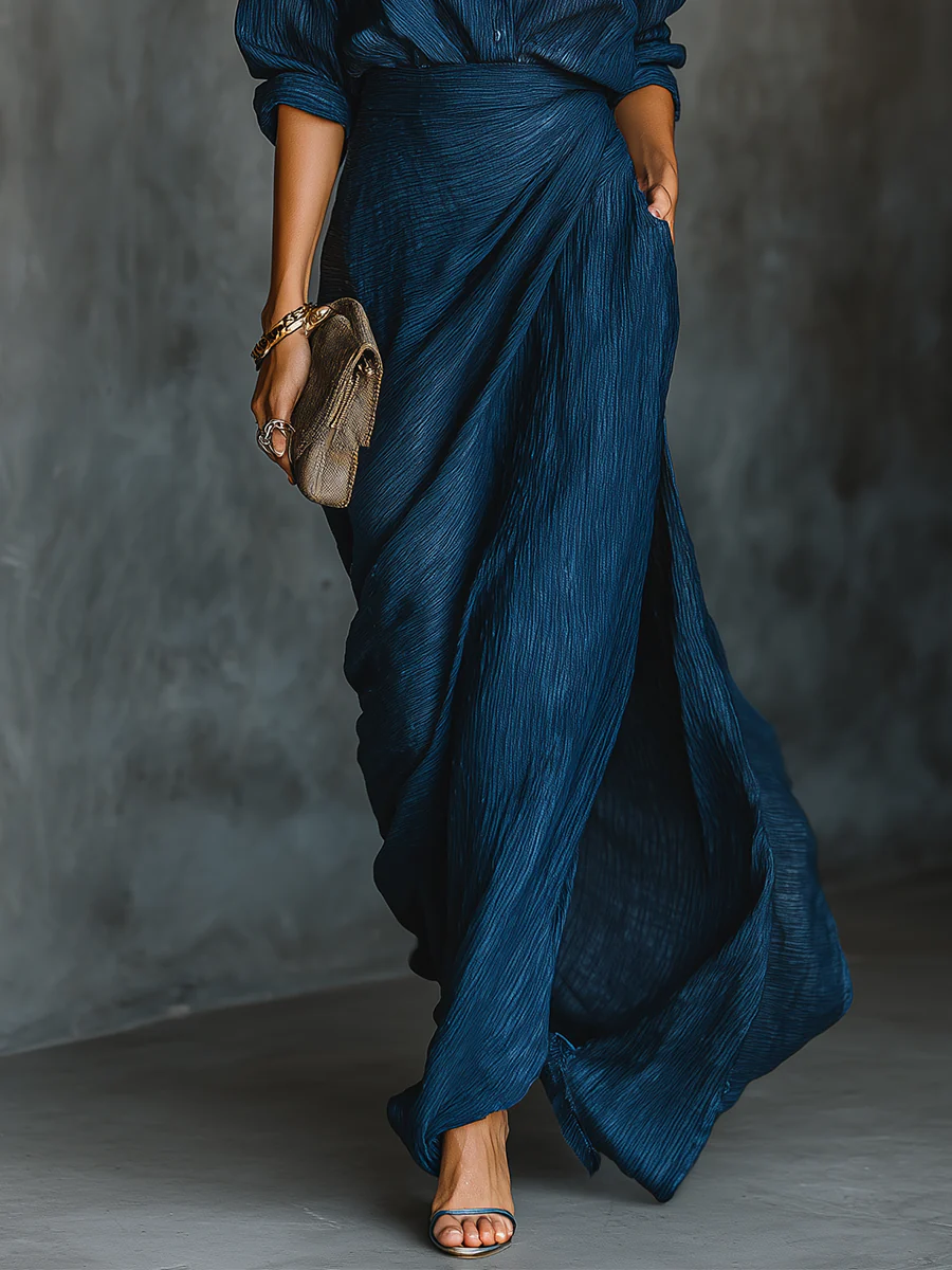 Dark blue wrap skirt with matching button shirt, long sleeves, side gathers