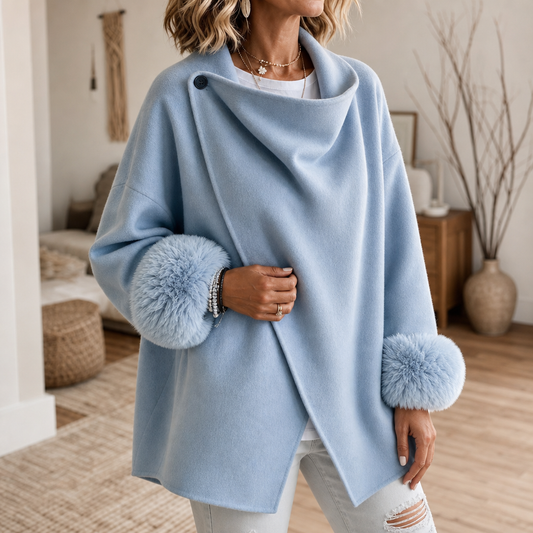 Light blue wrap jacket with faux fur cuffs and asymmetric hem, close-up