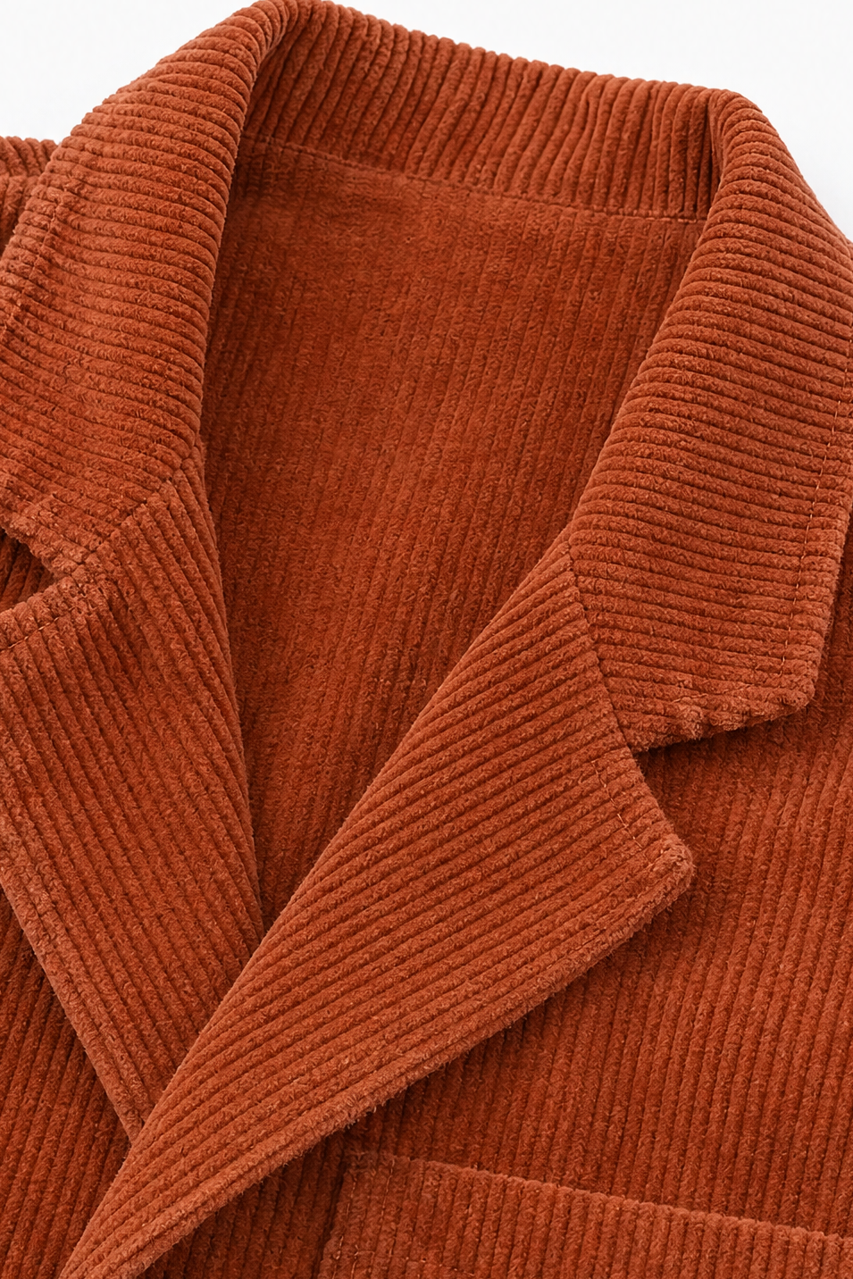 Rust-orange corduroy-look jacket fabric with textured knit-like ridges