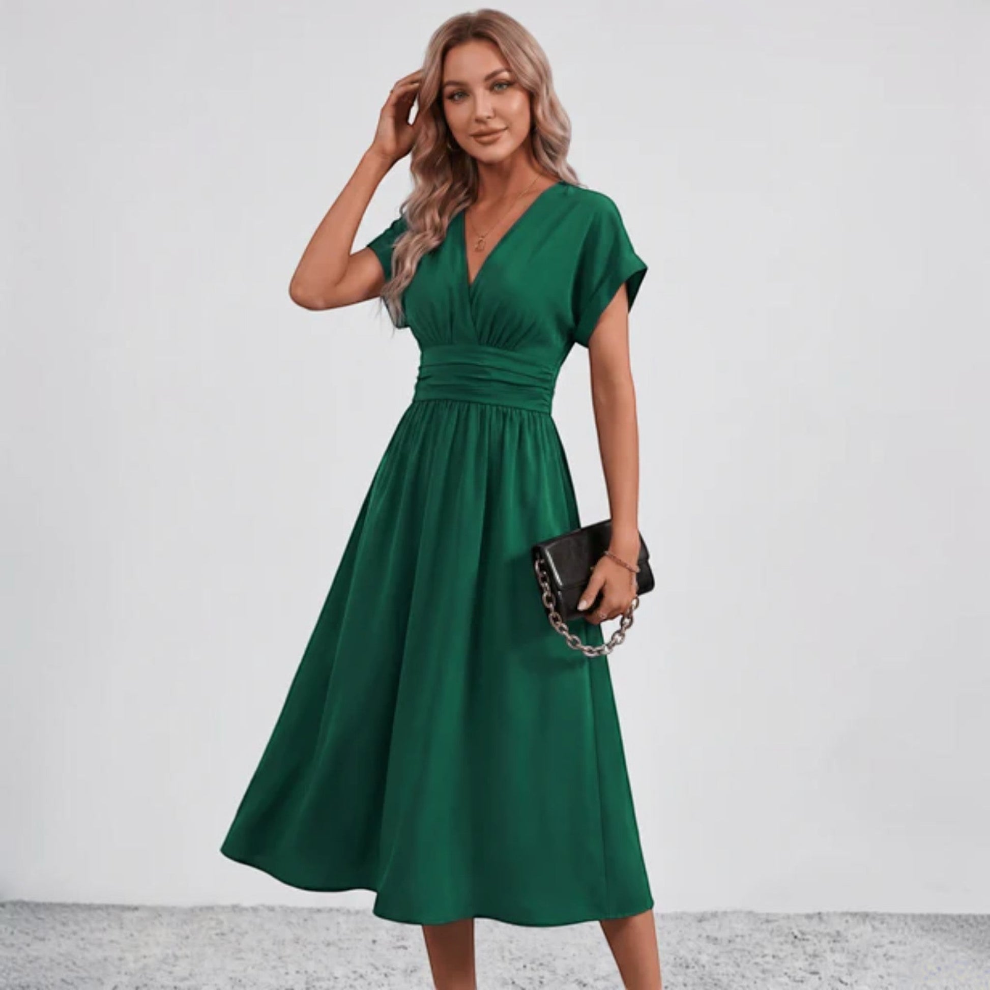 Green fit-and-flare midi dress with ruched waist seam and V-neck short sleeves