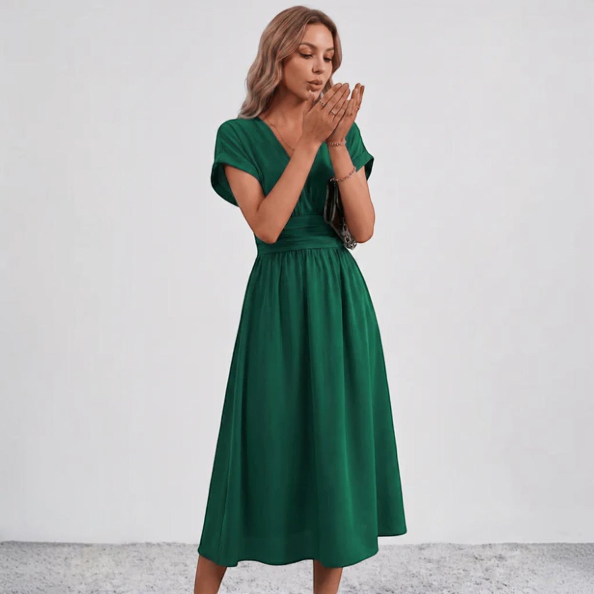 Green ruched-waist midi dress with V-neckline and short puffless sleeves