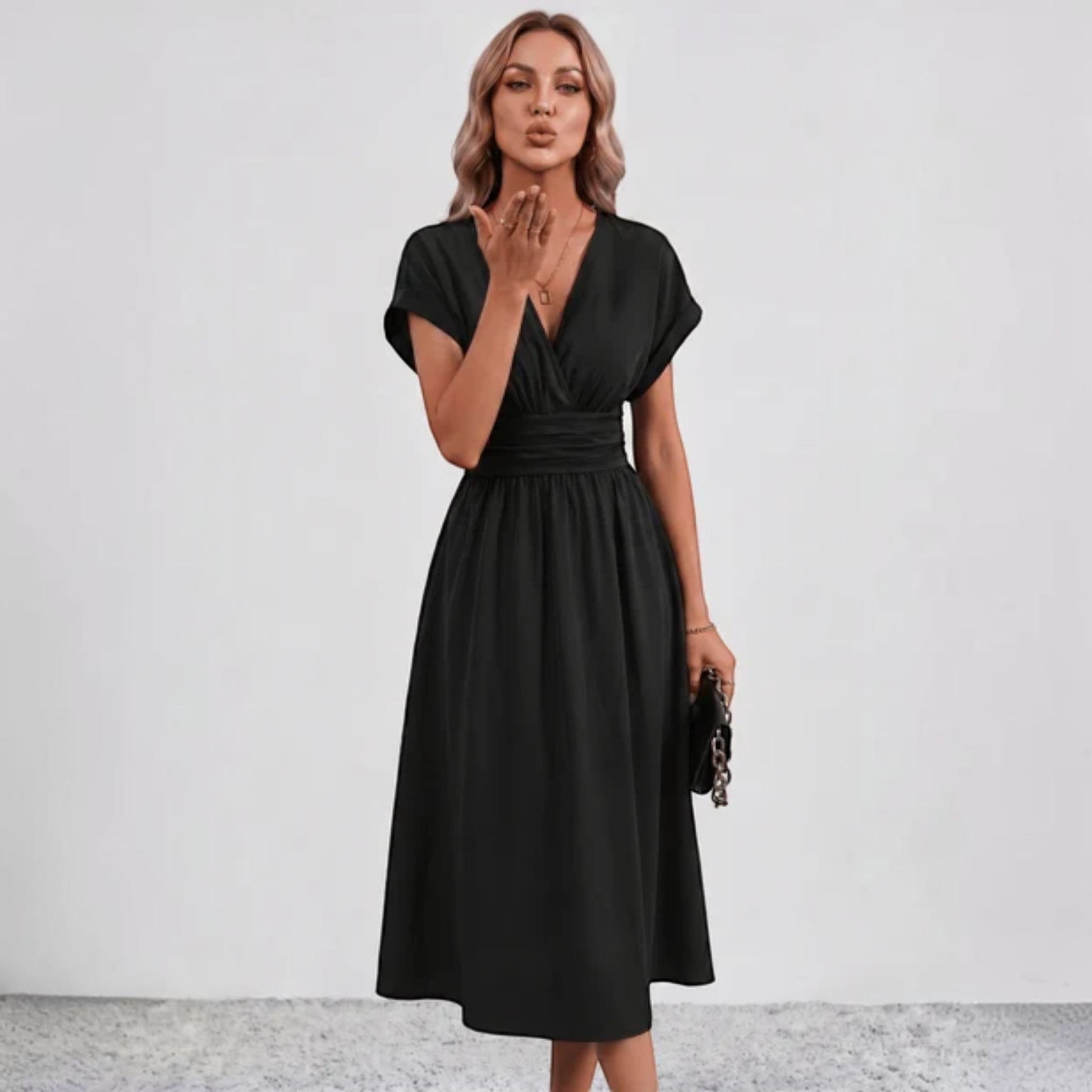 Black V-neck midi dress with ruched waist and short sleeves, flared skirt