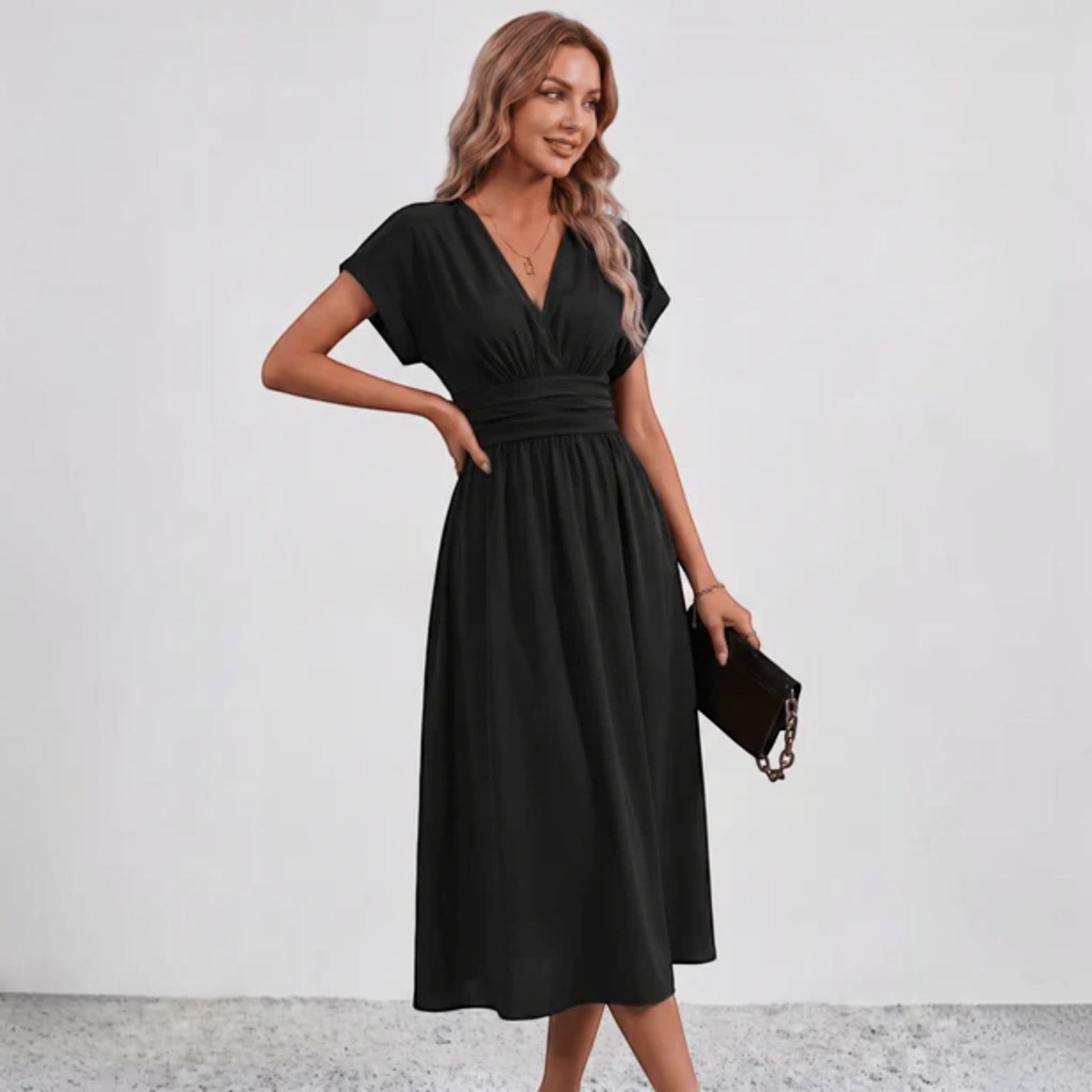 Black fit-and-flare midi dress with ruched waist detail and V-neck short sleeves