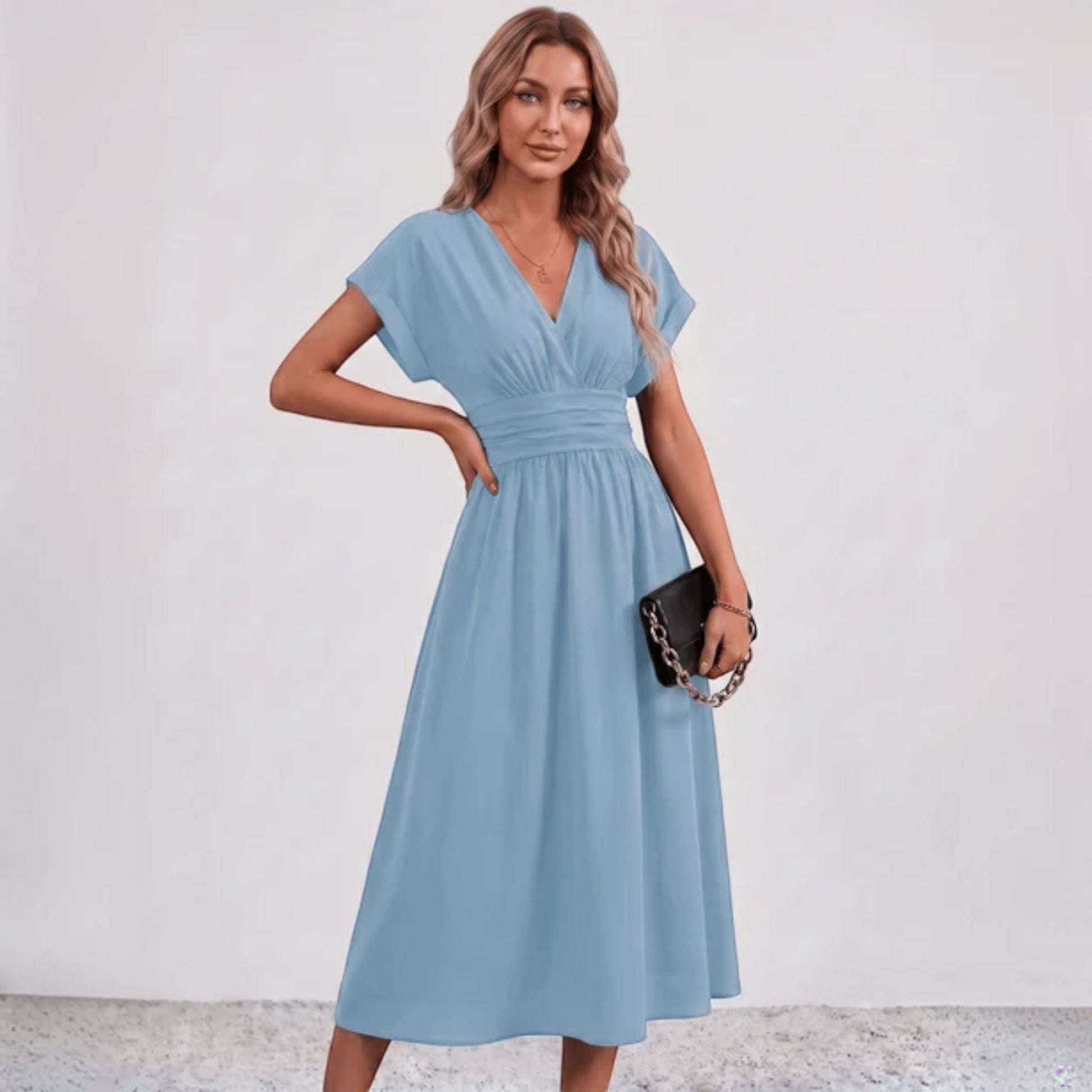 Blue V-neck midi dress with ruched waist, short sleeves, and flared skirt