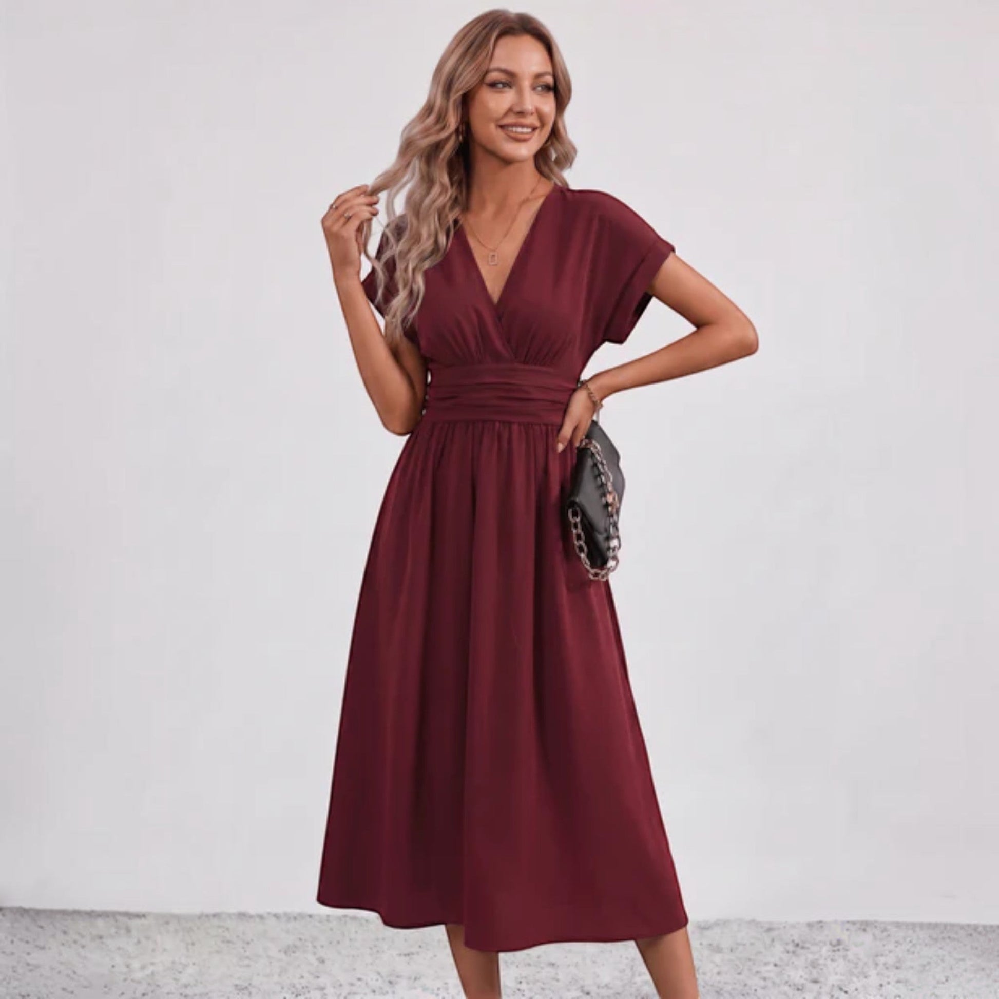 Burgundy V-neck ruched-waist midi dress with short sleeves and flared skirt