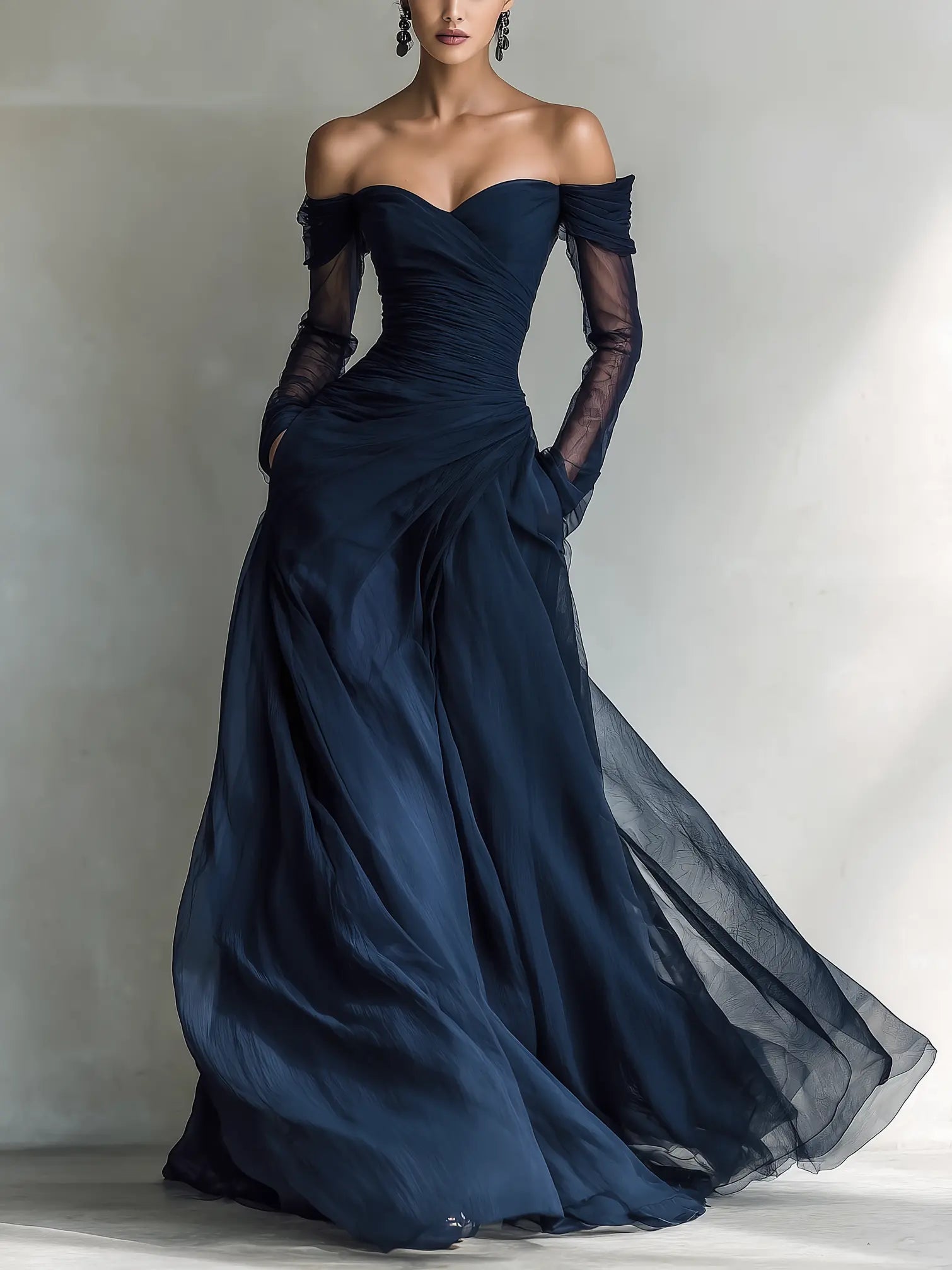 Fitted dark blue chiffon off-shoulder maxi dress with sheer long sleeves and draped skirt
