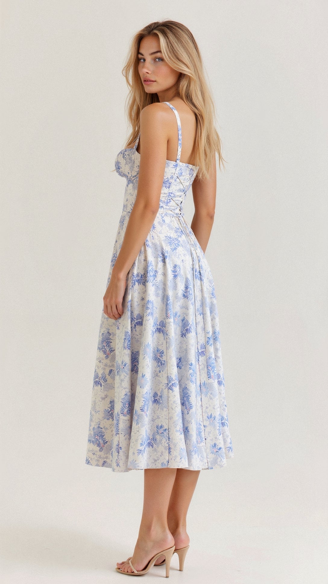 Light blue floral fitted midi dress with thin straps and defined waist, midi