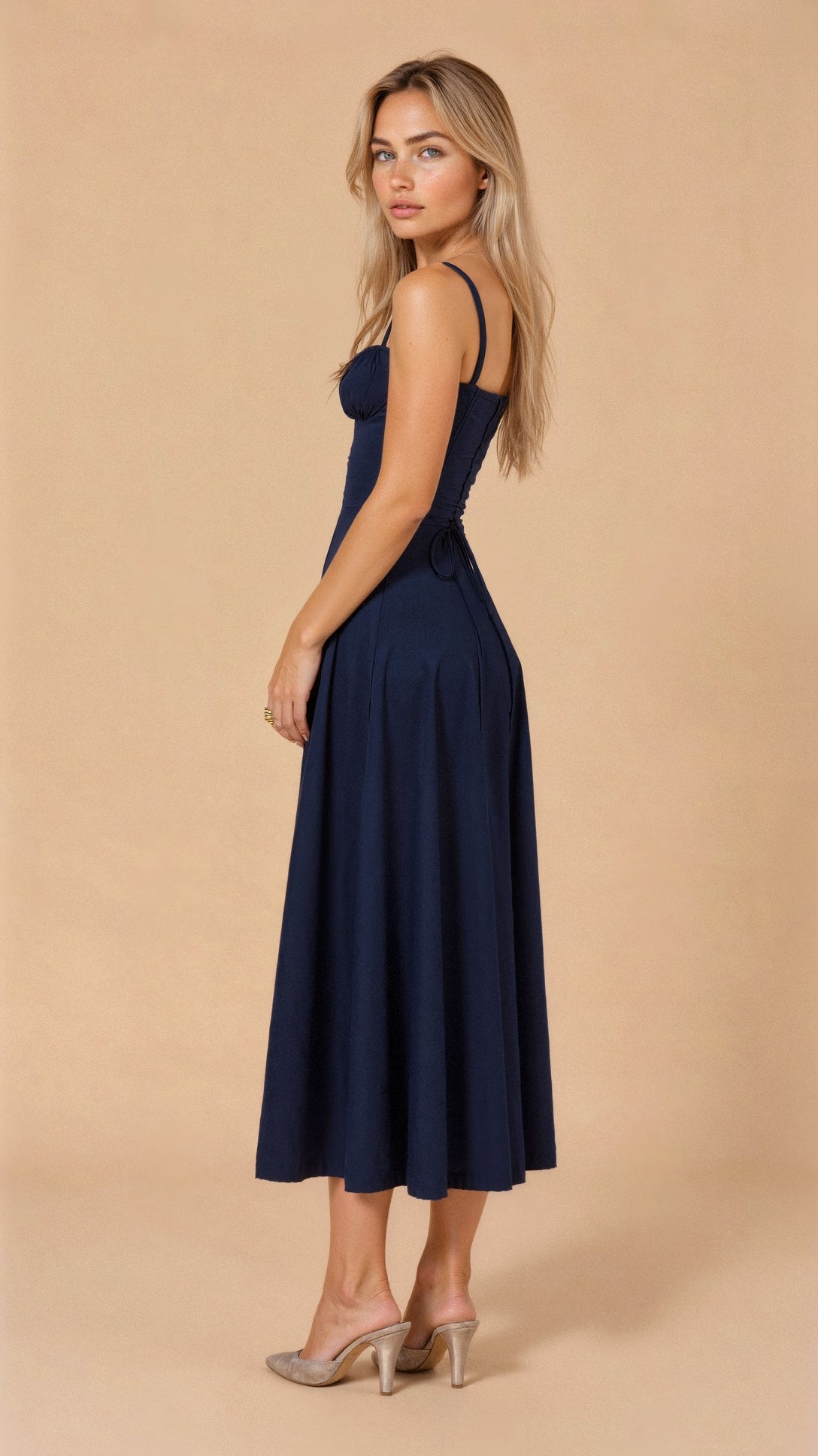 Navy fitted midi dress with spaghetti straps, gathered waist and midi skirt