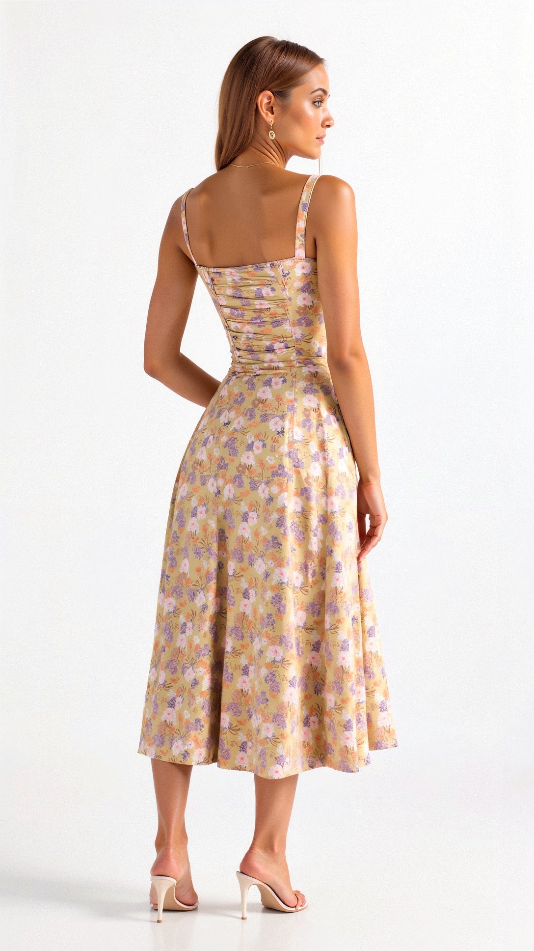 Yellow floral fitted midi dress with thin straps and defined waist, midi length