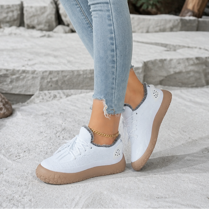 White lace-up casual shoes with fuzzy collar lining and gum rubber sole