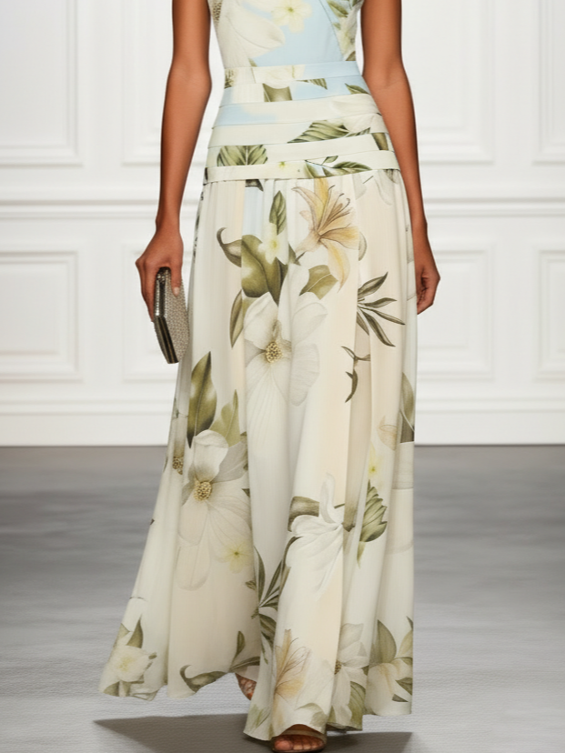 Light cream floral sleeveless maxi dress with boat neckline and wide pleated skirt panels.