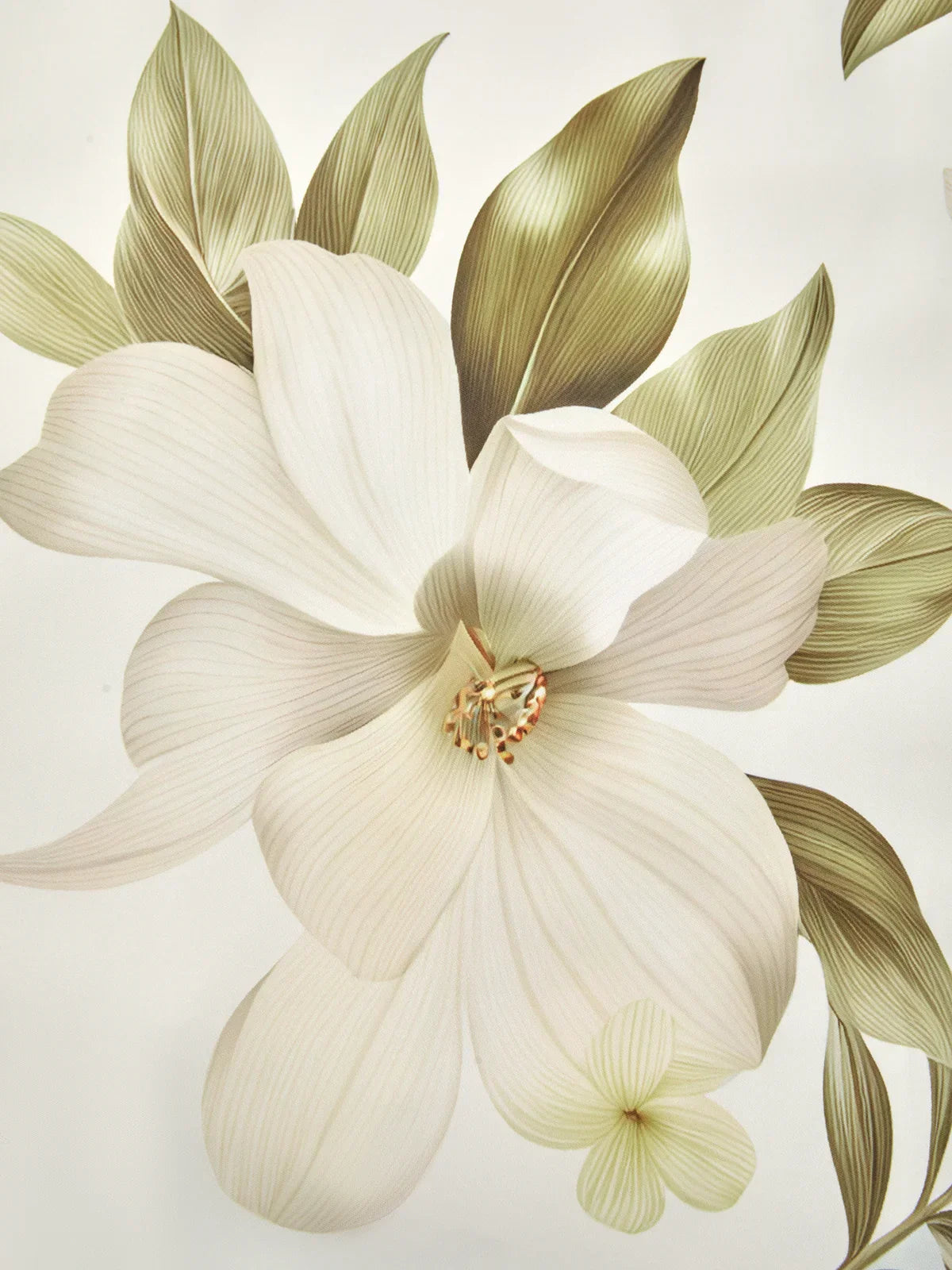 Close-up floral print detail: cream petals with pale green leaves on soft background.