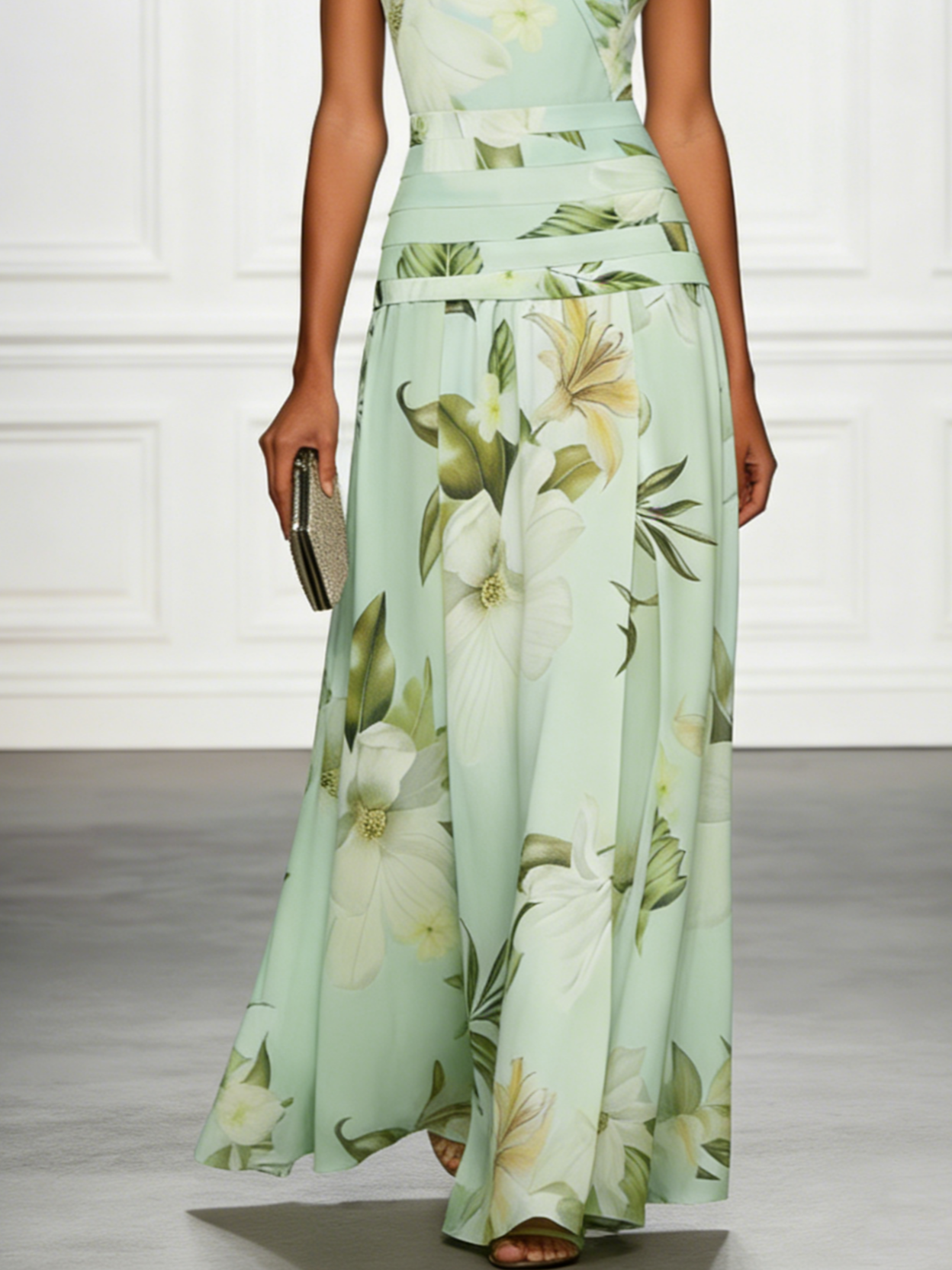 Pale green floral sleeveless maxi dress with boat neckline and flowing long skirt hem.
