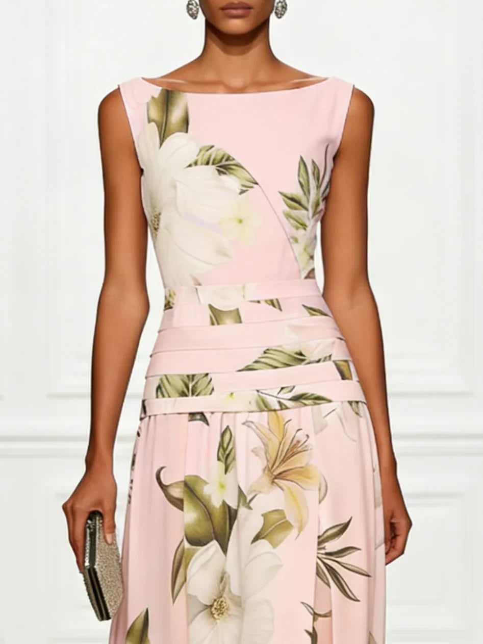 Pink floral boat-neck sleeveless maxi dress with layered waist bands and gathered skirt.